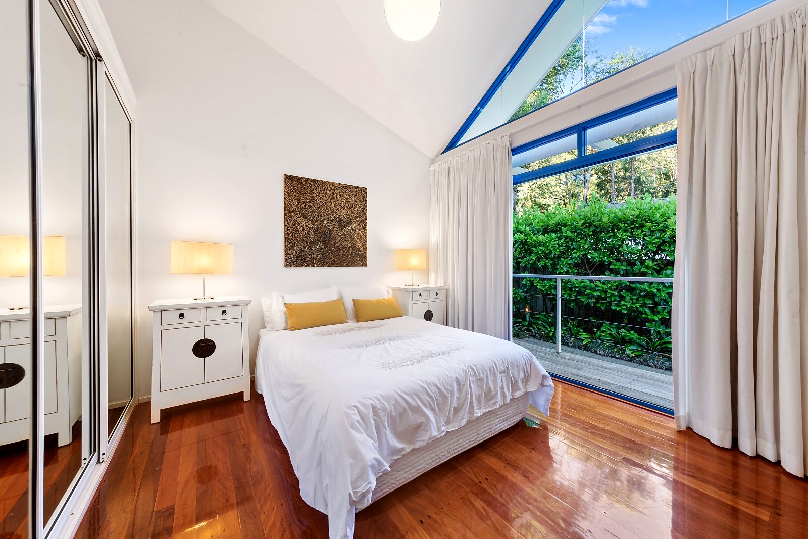 Second bedroom at Sails Pearl Beach with queen bed and mirrored robes
